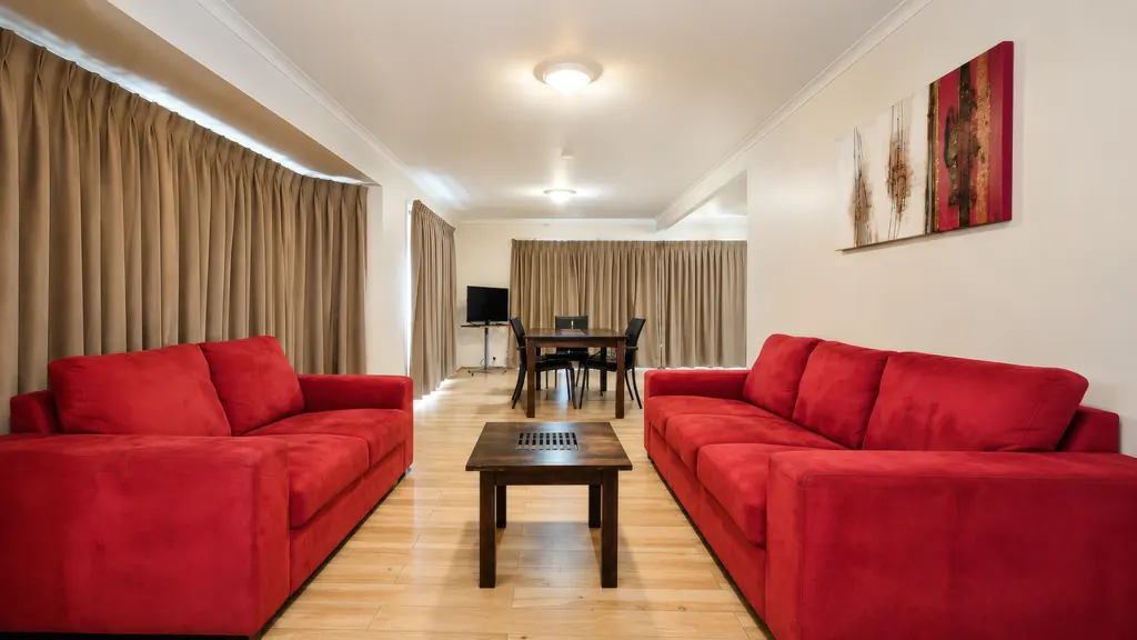 Family Room Apartment full kitchen with fridge, cooktop and sink